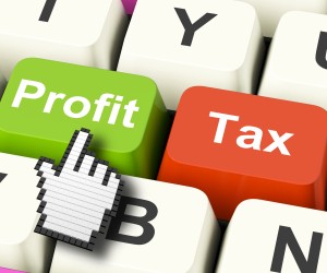 Profit Tax Computer Keys Showing Paying Company Taxes